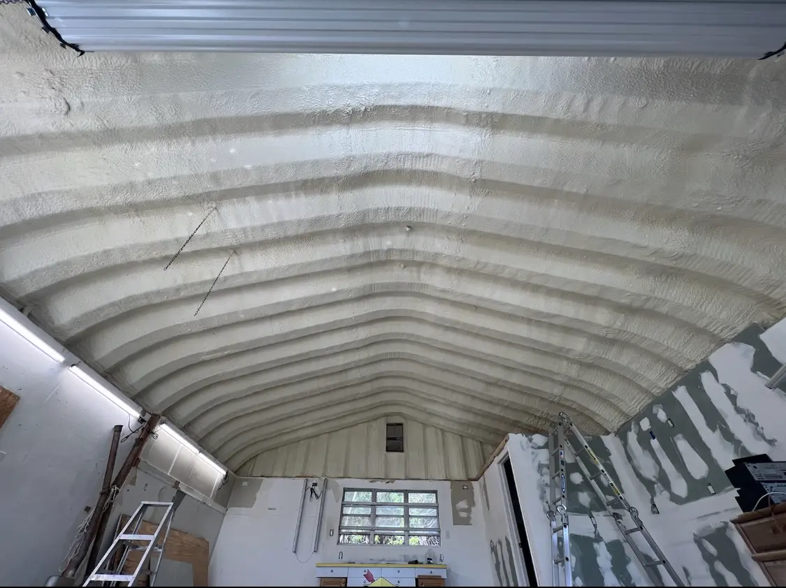 Spray polyurethane foam applied to the underside of a metal roof deck in Encinitas